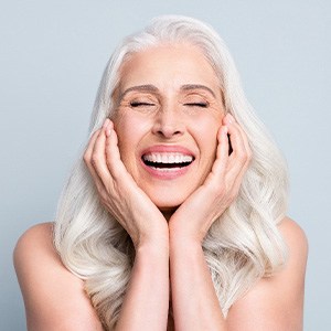 a dental implant patient smiling