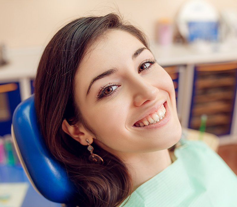 Woman sharing smile after cosmetic dental bonding treatment