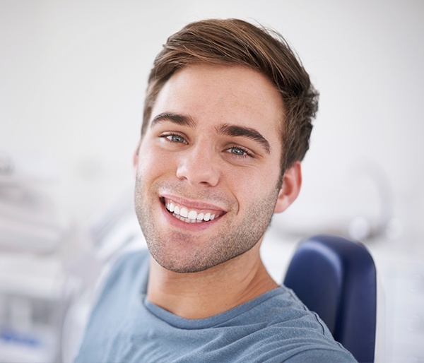 Man smiling after tooth shaping treatment