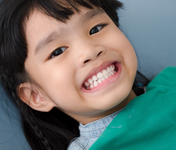 Child smiling during dental checkup