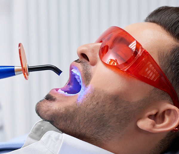 Man receiving dental bonding treatment