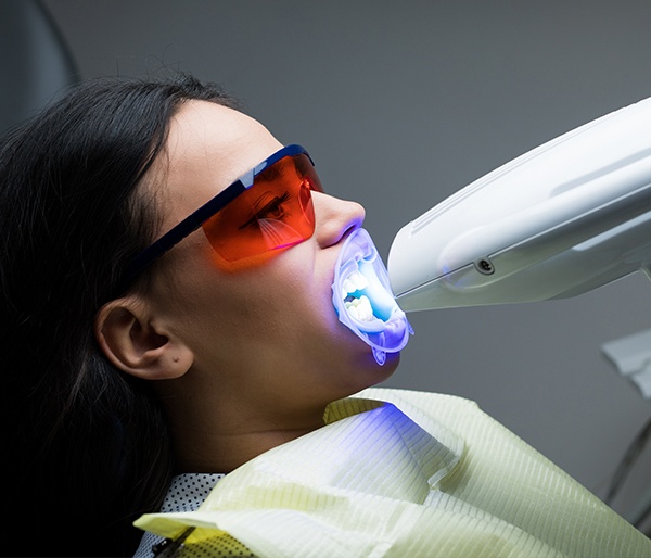 Patient receiving teeth whitening treatment