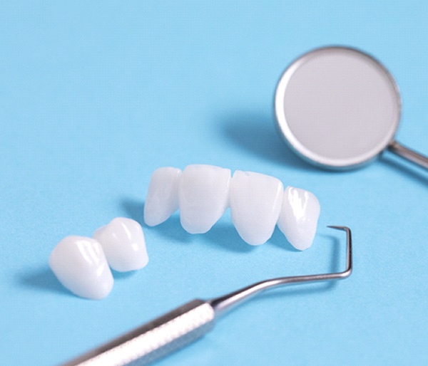 dental bridge and two crowns on a counter