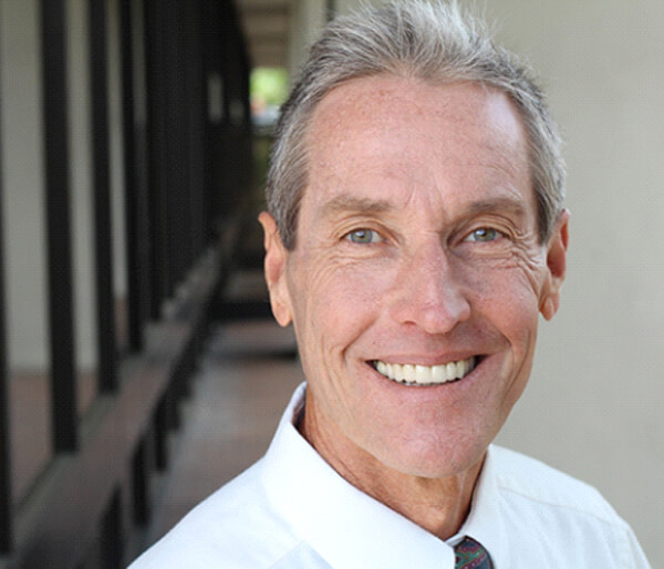 Handsome senior man enjoying benefits of dentures in Flint