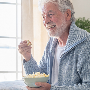 Man eating a bowl of popcorn