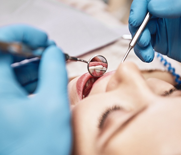 Closeup of woman preparing for tooth extraction in Flint