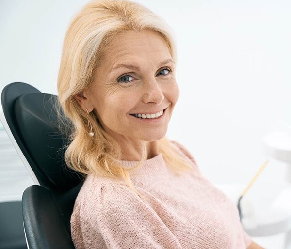 Woman after failed dental implant in Flint