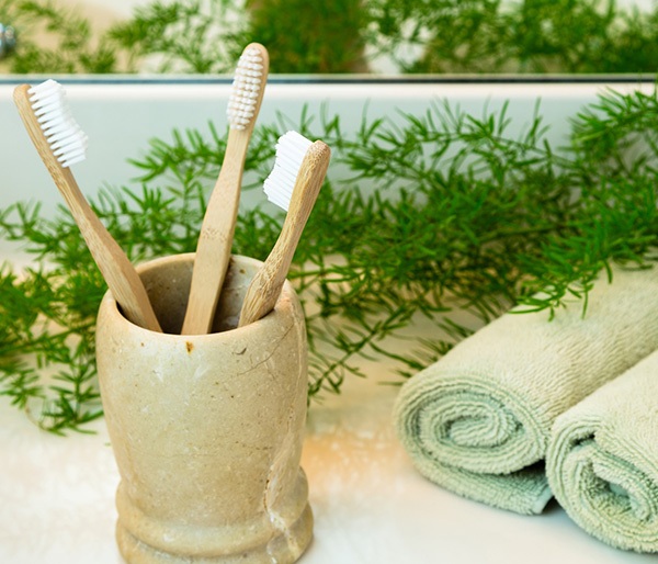 Toothbrushes in clay cup