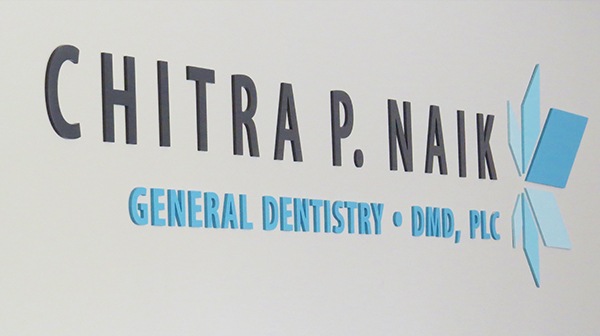 Chitra P. Naik DMD logo on dental office wall
