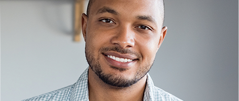 Man with healthy smile after gum disease treatment