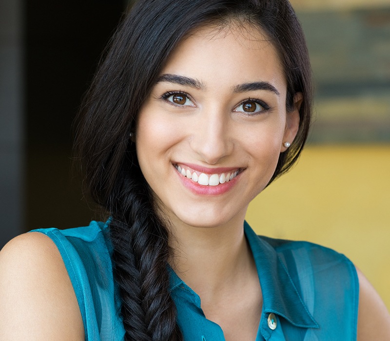 Woman with brilliant smile after teeth whitening