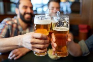Men drinking beer in a bar 