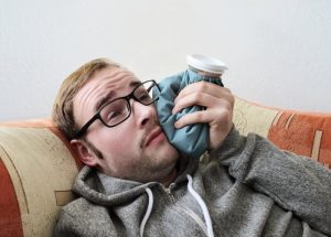 person with an ice pack on their face