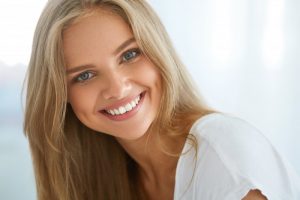 woman blonde hair beautiful teeth