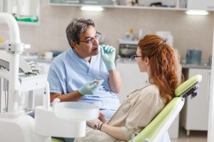 dentist talking to patient