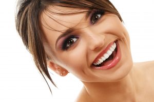 woman brunette smiling perfect teeth